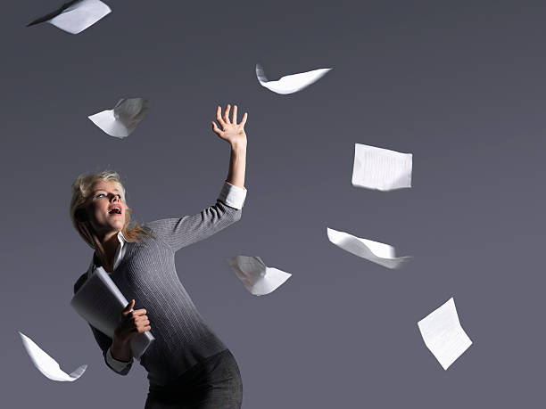 istock Young Businesswoman With Scattering Papers 494351279
