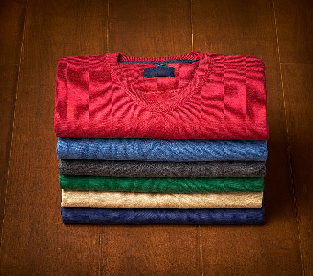 istock mens sweater on wooden background 494351600