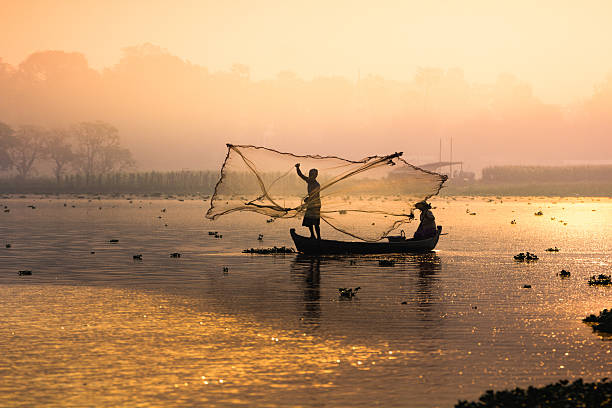 istock Fisherman fishing from river 494351904