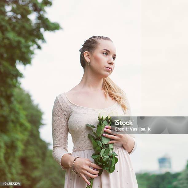 Pretty Romantic Blonde With Flowers Outdoor Stock Photo - Download Image Now - 2015, Adolescence, Adult