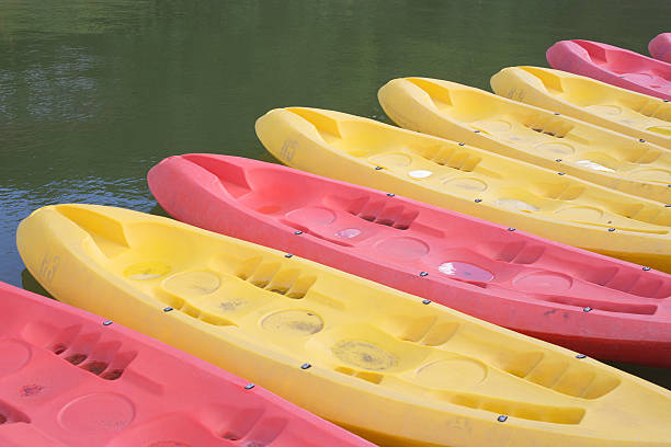 istock canoes moored with on  water. 494354102