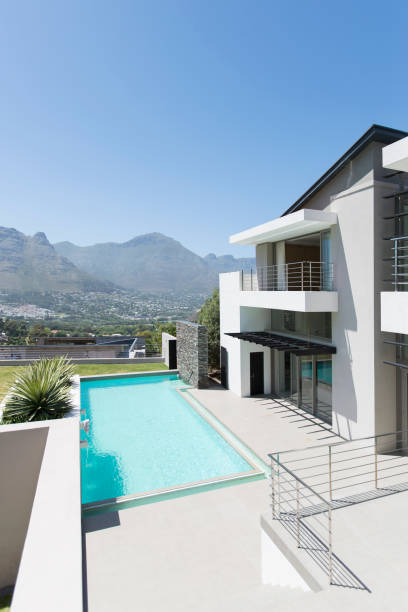 istock Modern house and swimming pool with mountain view 494358103