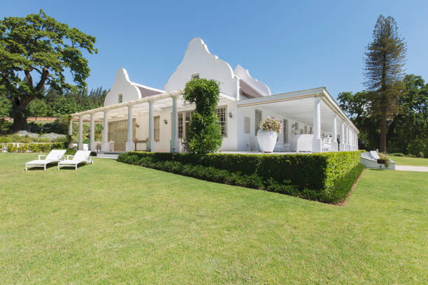 istock Hedges and grass surrounding luxury house 494358175