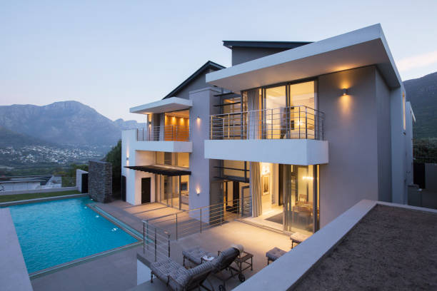 istock Modern house with swimming pool at dusk 494358331