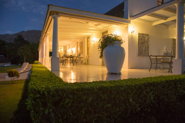 istock Luxury house with porch illuminated at night 494358409