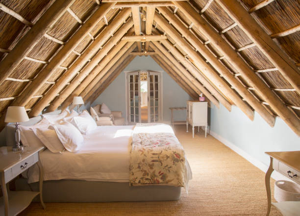istock Sunny luxury attic bedroom 494358429