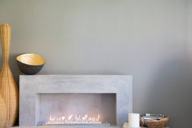 istock Apple art above fireplace in modern living room 494358475