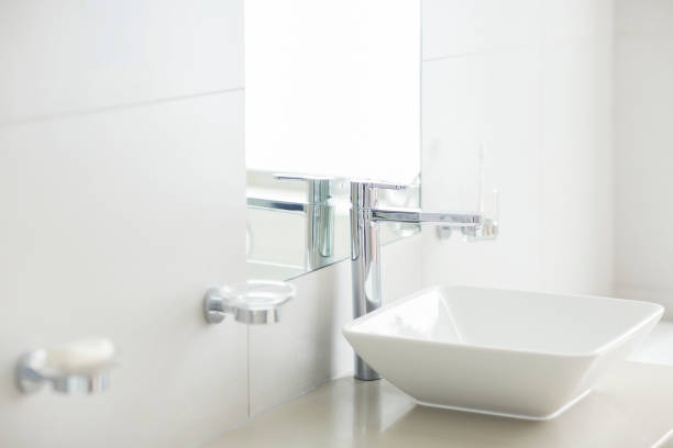 istock Sink in sunny modern bathroom 494358519