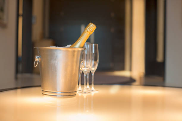istock Champagne in silver bucket next to champagne flute 494358567