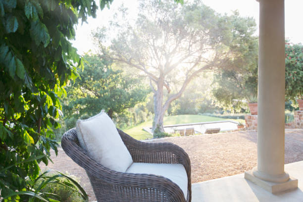 istock Wicker armchair on tranquil patio 494358583