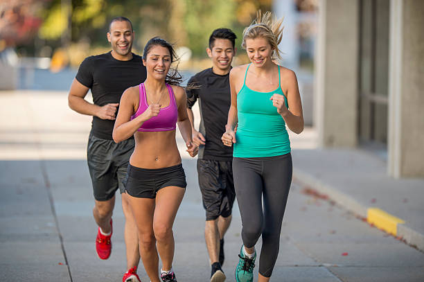 istock Couples Running Together Through the City 494376728