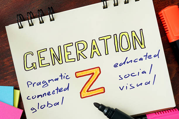 notepad with generation z on the wooden table. - generatie z stockfoto's en -beelden