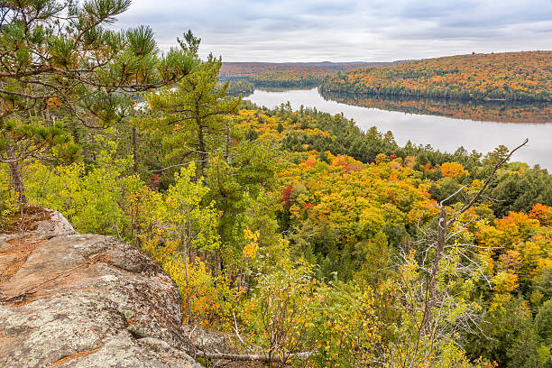 istock Precambrian Rock with Fall Colors and a Lake 494377784