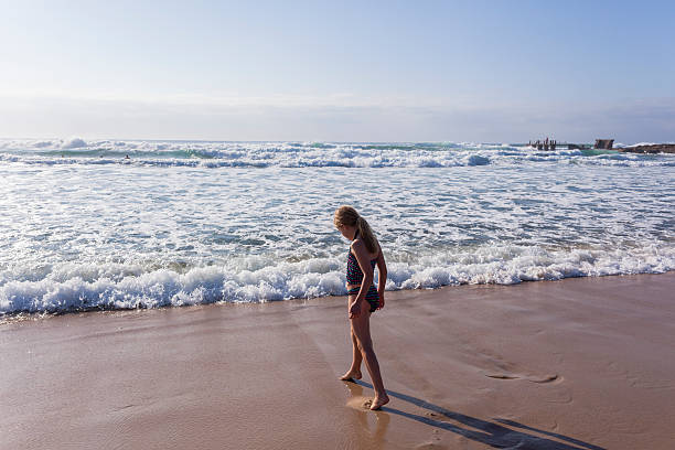 istock Girl Walking Beach Swim 494378076