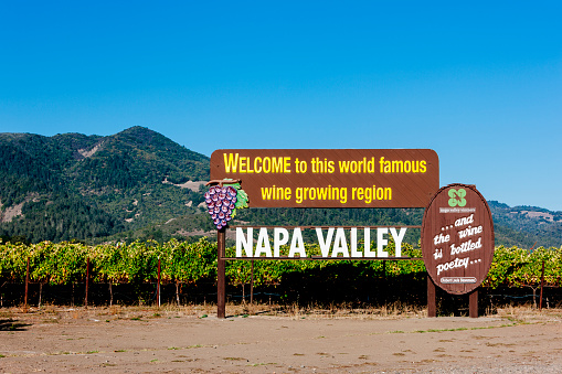 Yountville, California, United States - October 19, 2015: Napa Valley wine sign on the south side of Highway 29 outside Yountville in California. One of two Napa Valley signs maintained by the Napa valley Vintners, it dates back to 1949 and is a must visit destination for camera ready tourists on wine tours.