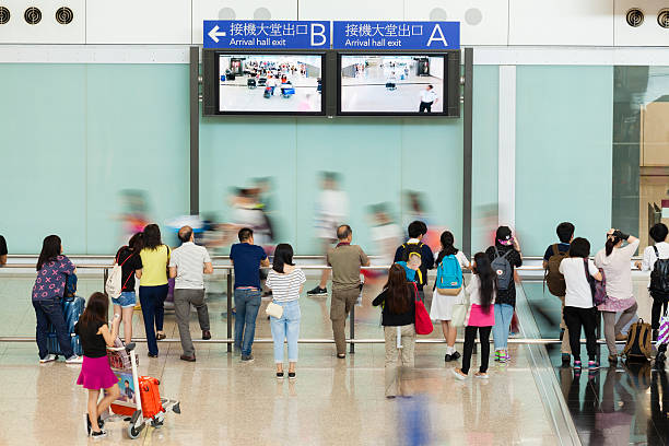 People at the arrival hall of an airport stock photo