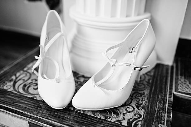 istock white bridal shoes on decor background 494380644