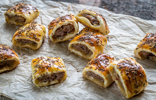 Homemade sausage rolls Homemade sausage rolls sausage roll stock pictures, royalty-free photos & images