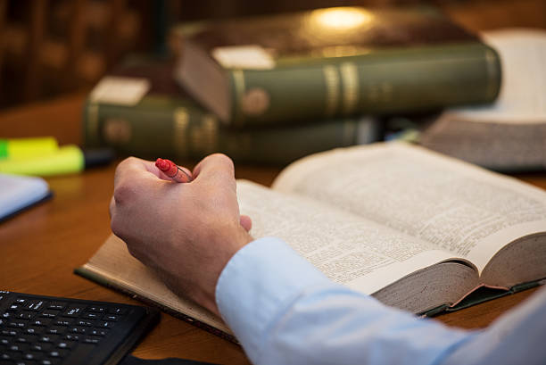 istock View of a man hand in public library 494386478