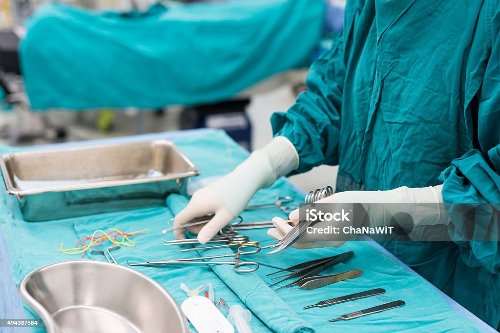 scrub nurse prepare medical instruments Surgery Stock Photo