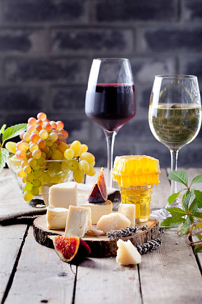 istock Grape, cheese, figs and honey with a glasses wine. 494388168