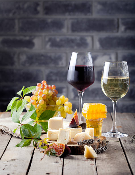 istock Grape, cheese, figs and honey with a glasses wine. 494388218