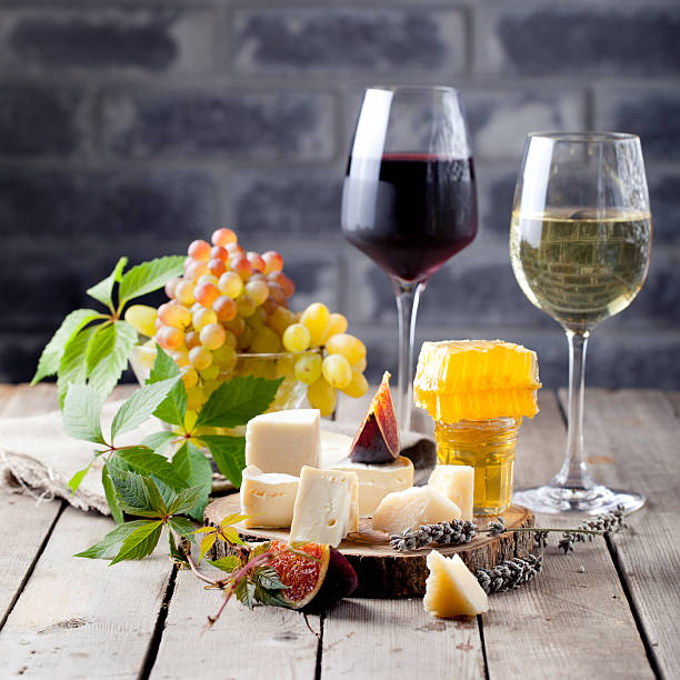 istock Grape, cheese, figs and honey with a glasses wine. 494388272