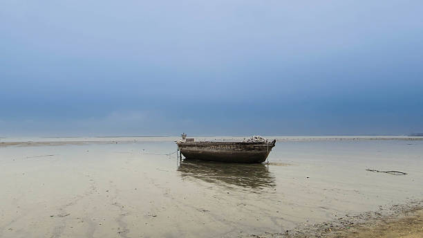 istock abandoned boat in the sea 494389218