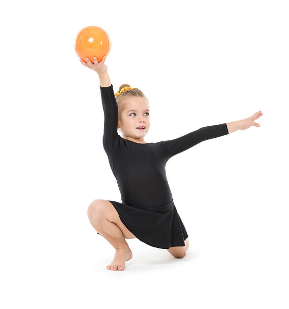 istock Little Gymnast Practicing with a Ball 494390234
