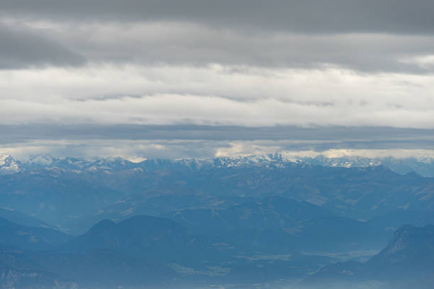 Austrian Alps from an Airplane on a foggy day.