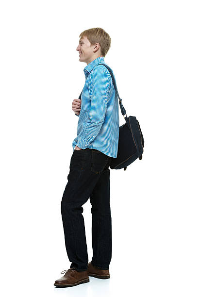 istock Side view of happy young man standing 494393827