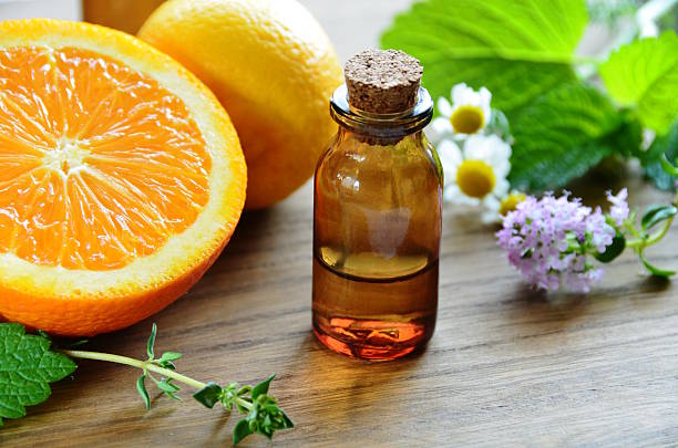 istock essential oils with fruits and herbs 494393937