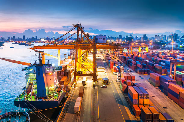 istock Cargo ship in the harbor at sunset . 494394143