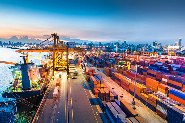 istock Cargo ship in the harbor at sunset . 494394151