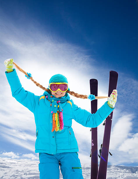 istock Blond, cute girl on ski winter vacation 494395559