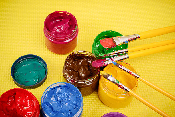 istock Colorful paints and artist brushes 494395731