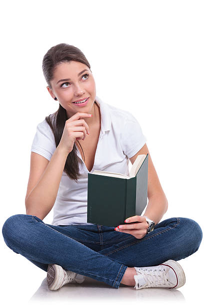 istock casual woman sits & reads & thinks 494396113