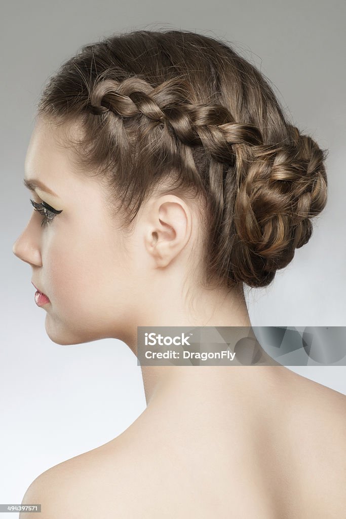 Hair Braid Portrait of young beautiful woman with blond hair and braid hairdo. Rear view, hairstyle with tress 20-29 Years Stock Photo