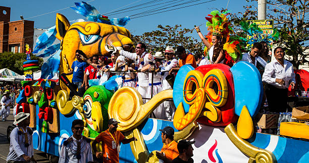 Barranquilla, Colombia - March 1, 2014: Barranquilla, Colombia - March 1, 2014 - Colorful floats full of singers, dancers, and models make their way down the street during the Battalla de Flores. The pinnacle parade of the Carnival de Barranquilla.