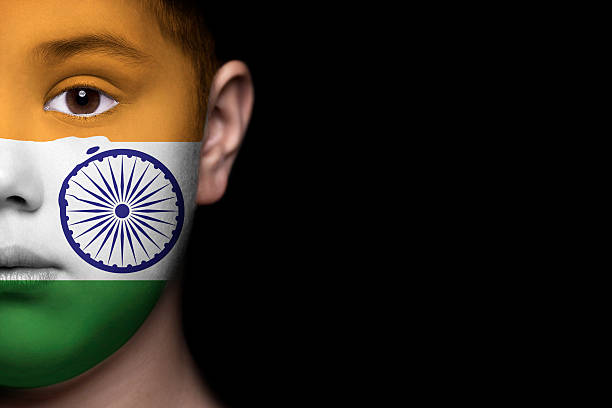 istock Human face painted with flag of India 494399463