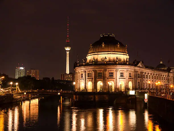 bode museum with spree and television tower by night
