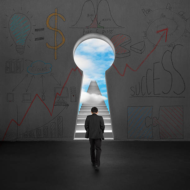 istock Walking toward key shape hole with stairs and blue sky 494401311