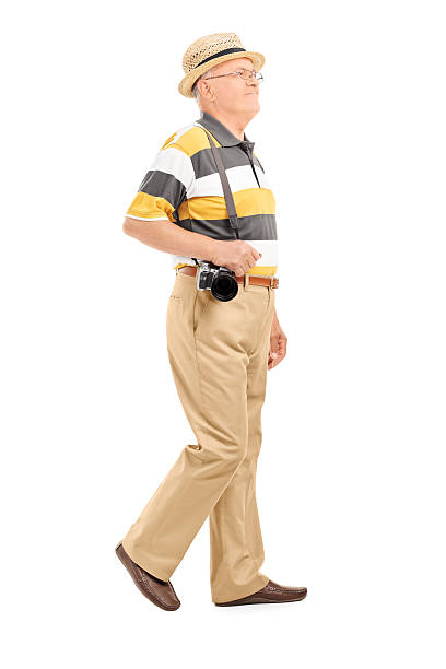 istock Mature tourist with camera walking 494411545
