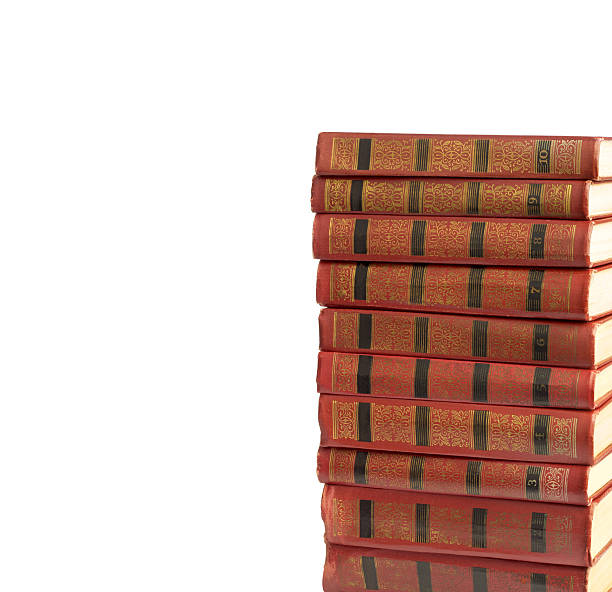 istock stack of old books with gold stamping on  white background 494411549