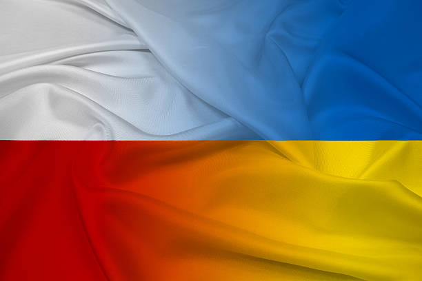 Waving Poland and Ukraine Flag stock photo