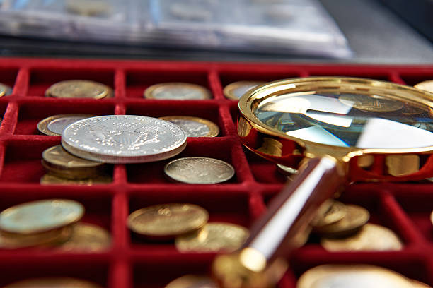 istock American silver dollar and magnifying glass 494413374
