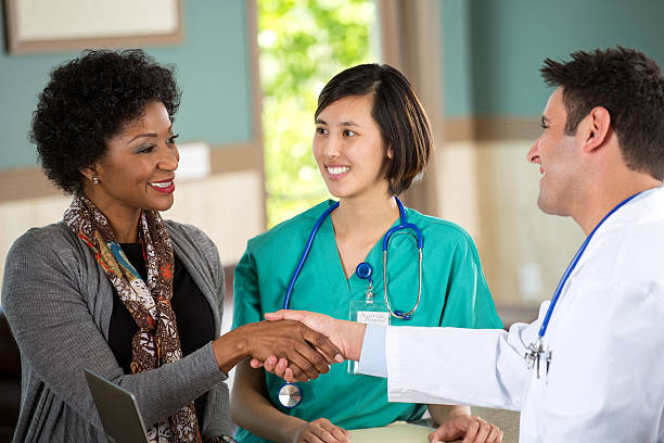 istock Medical team talking with patient 494414051