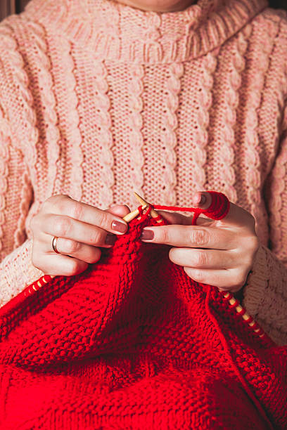 istock Female hands knits sweater 494414114