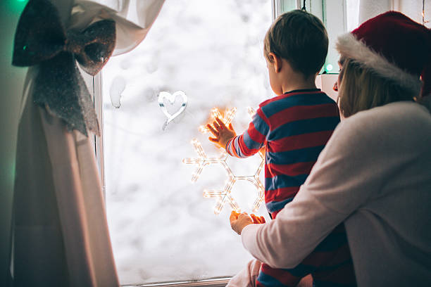 istock Christmas Eve by the frosted window 494414148