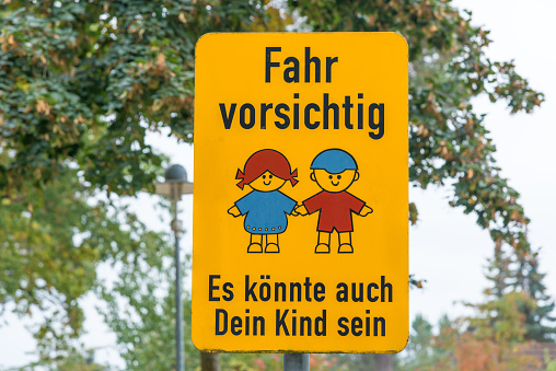 german traffic sign - drive careful, it could be your child too